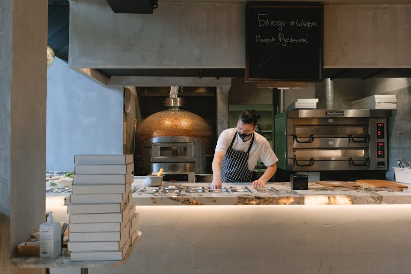 Mod Pizza catering team preparing fresh pizzas for event